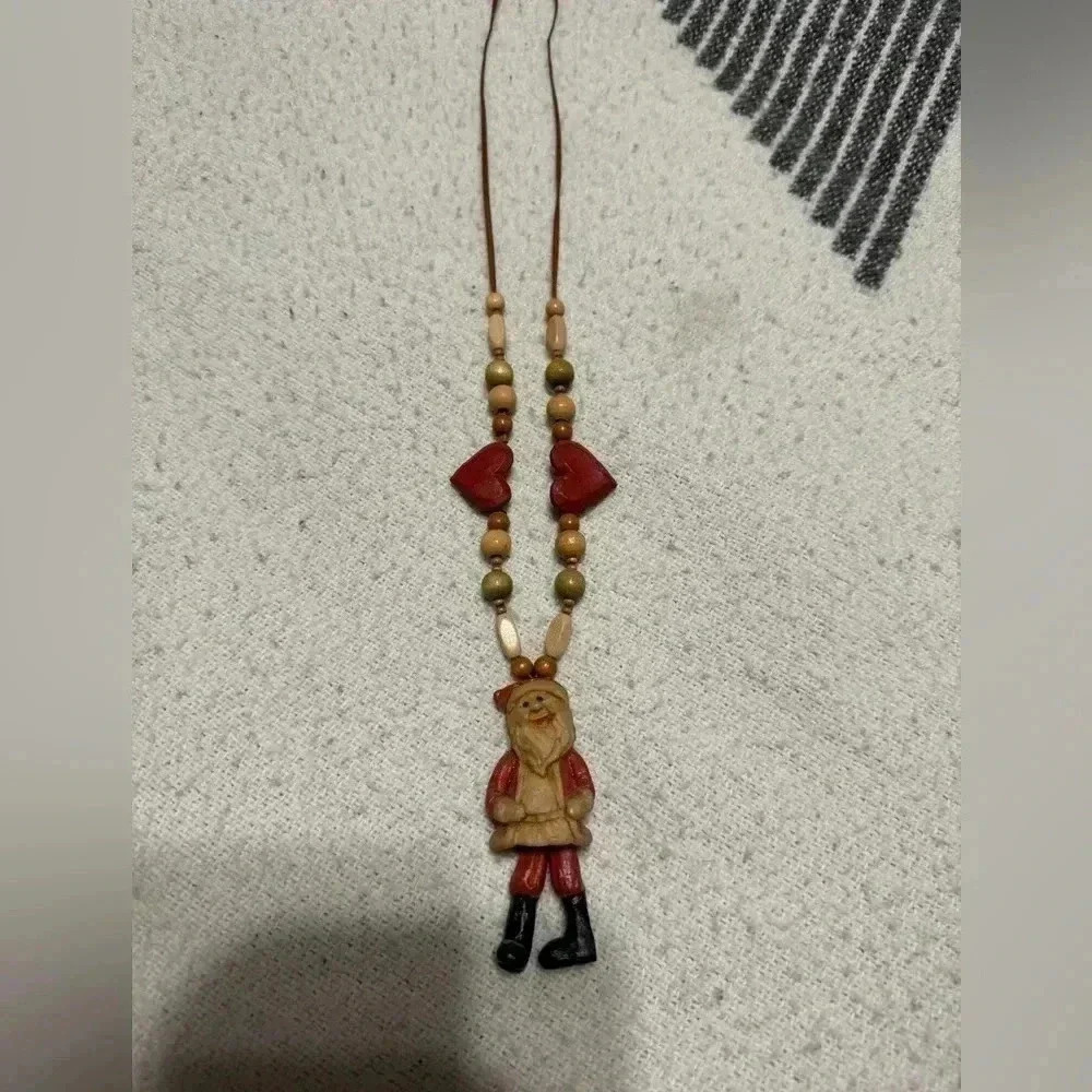 Cute Santa Necklace with adjustable length.   Never worn.